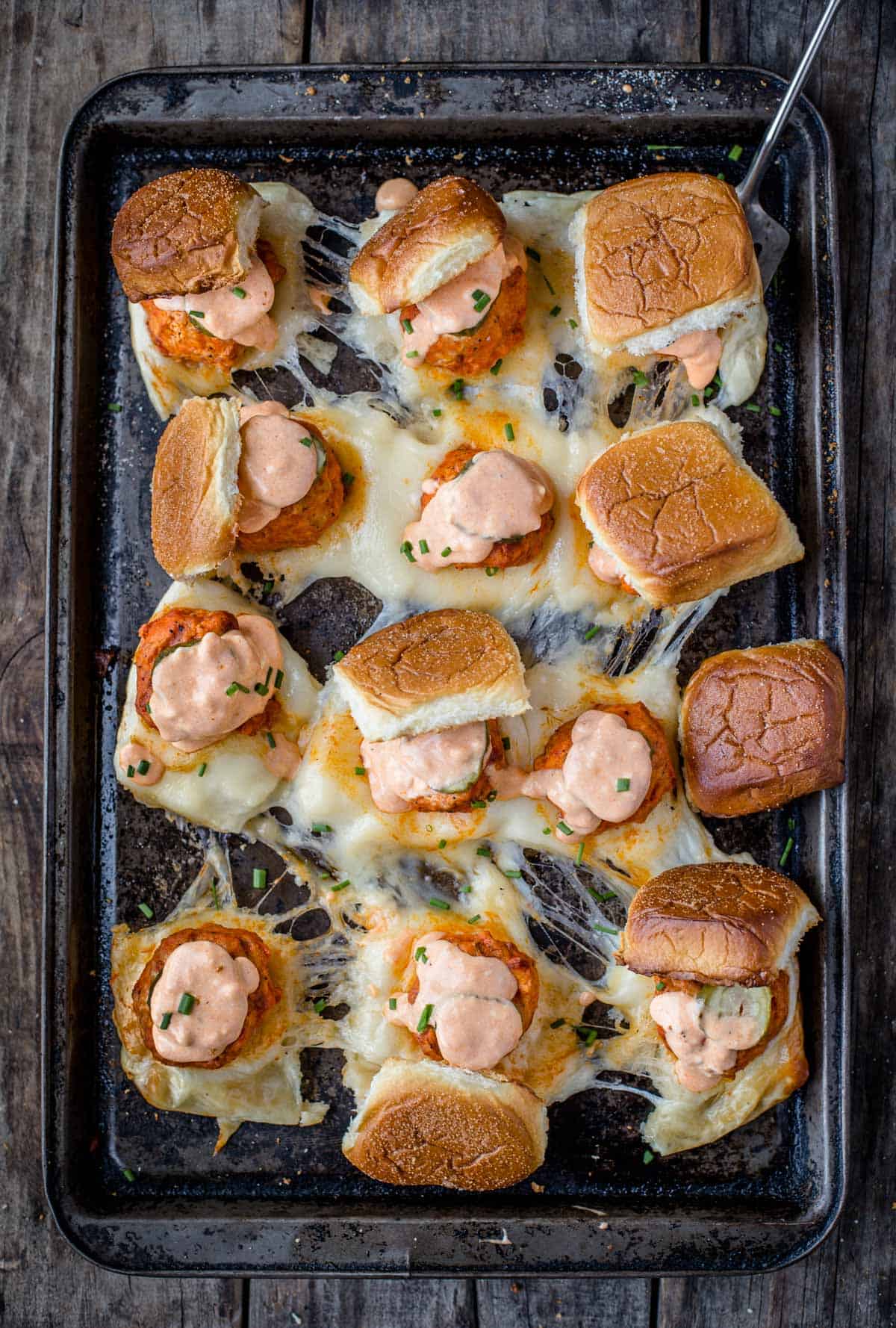 A tray filled with 12 Grilled Buffalo Meatball Sliders 
