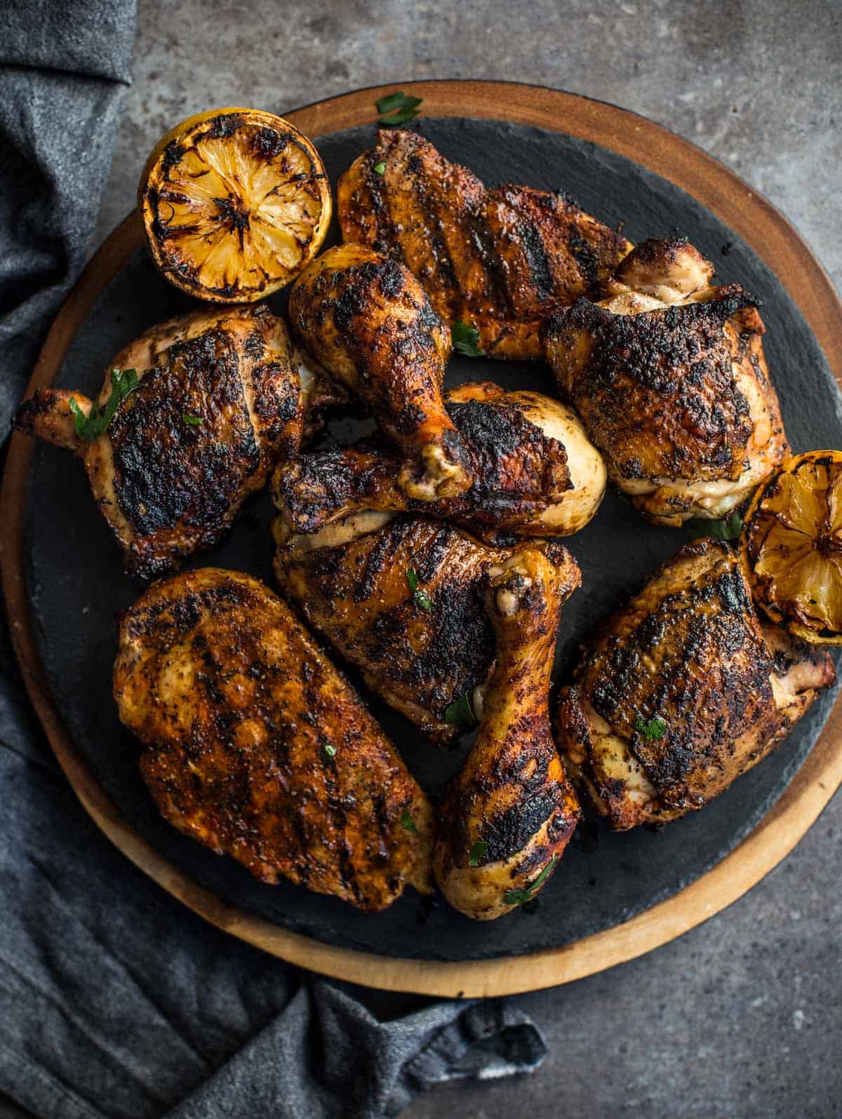 Pieces of Grilled Jerk Chicken on a serving platter