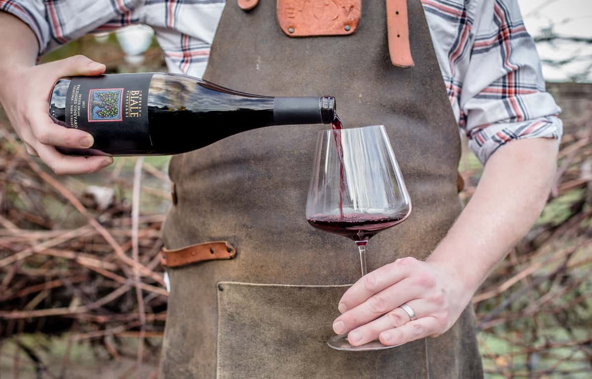 Pouring Petite Sirah into a wine glass
