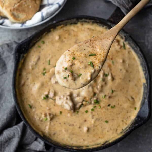 Cast Iron pan of sausage gravy and biscuits.