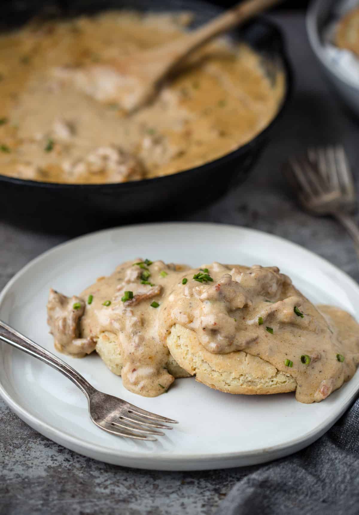 A plate with biscuits and Smoked Sausage Gravy