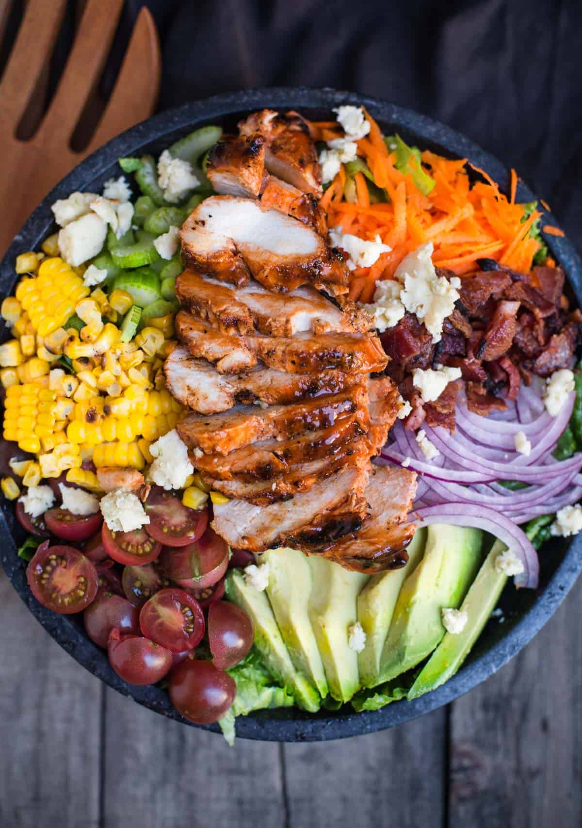 Grilled Buffalo Chicken Salad in a large black serving bowl