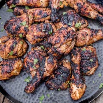 Pieces of grilled Jerk Chicken on a platter