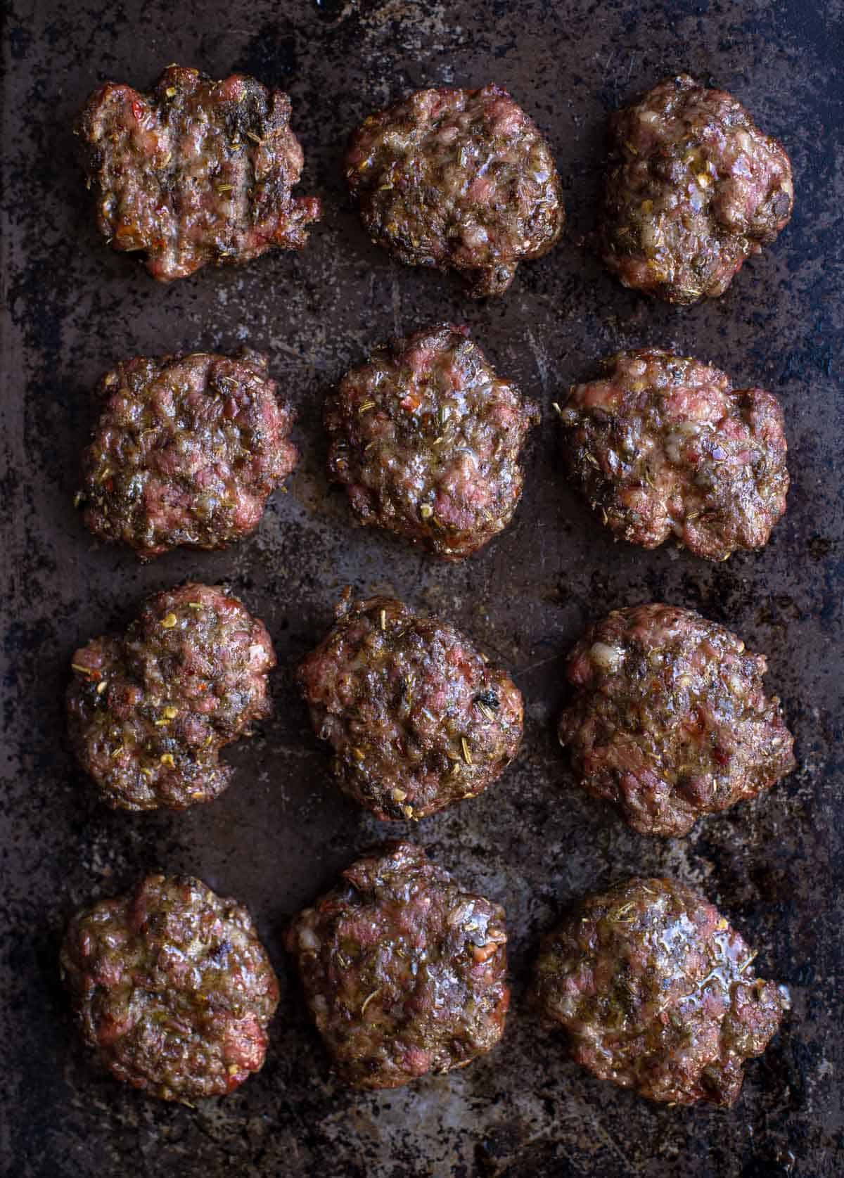 12 homemade breakfast sausage patties on a sheet pan