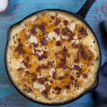 Grilled Mac and Cheese in a cast iron pan with bacon and panko topping.
