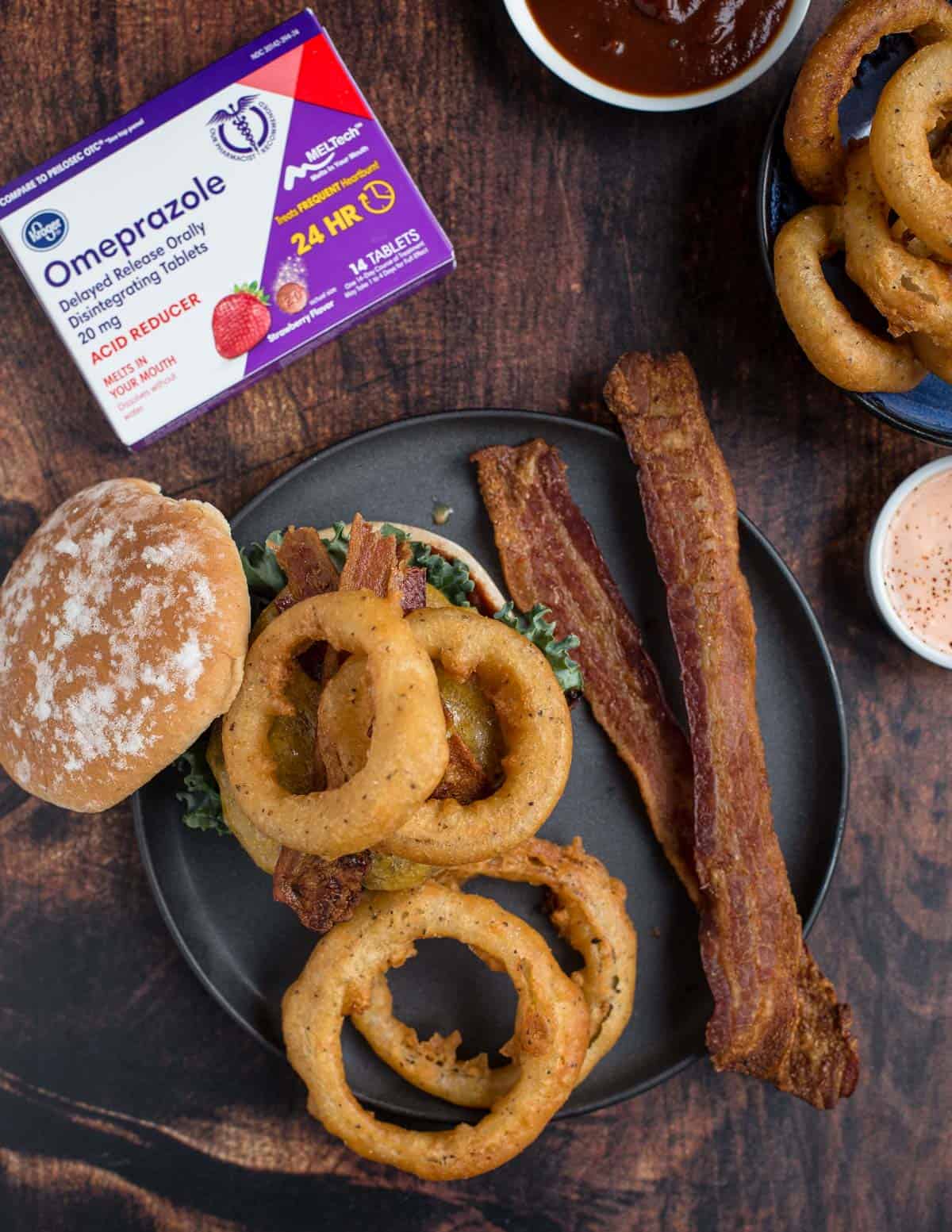 Beer battered onion rings and western style burger with bacon. Sponsored by Omeprazole ODT.