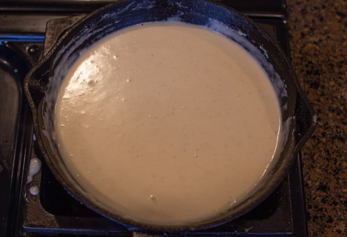 Basic white sauce, or Béchamel sauce in a cast iron pan
