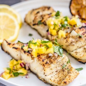 close up of grilled halibut with mango salsa