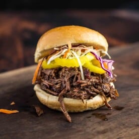 Shredded Smoked Pulled Beef Sandwich on a cutting board