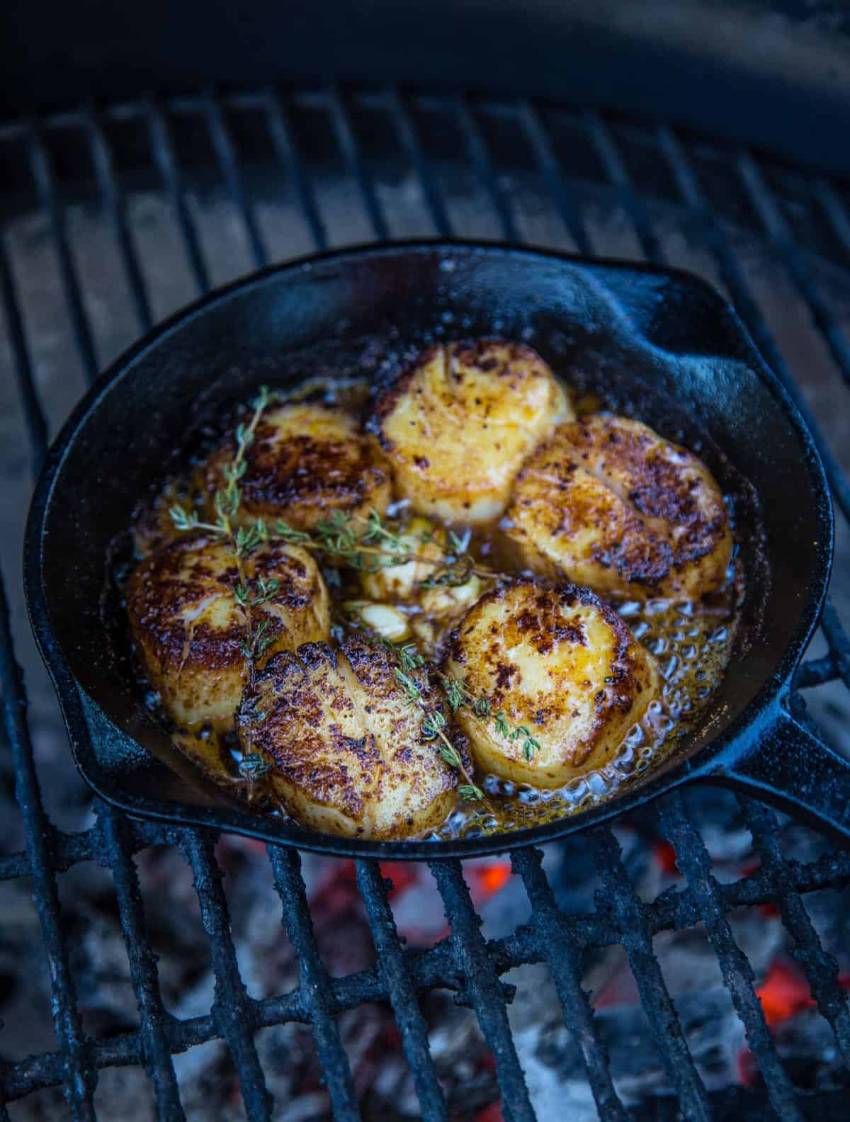 Grilled U10 scallops in a cast iron pan