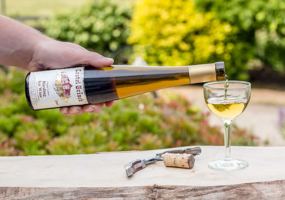 pouring a bottle of ice from the Finger Lakes wine into a glass