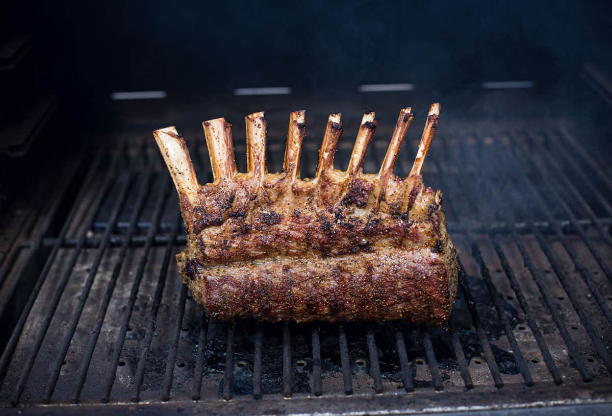 Final step by standing up lamb to grill the bottom portion of the rack.