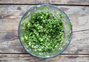 dry ingredients for a jalapeño chimichurri sauce in a food processor