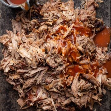 pulled pork on a sheet pan with sauce