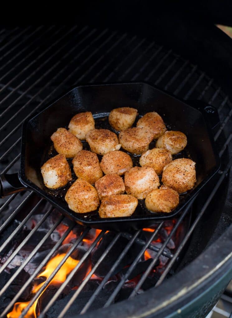 raw scallops in a pan on the grill