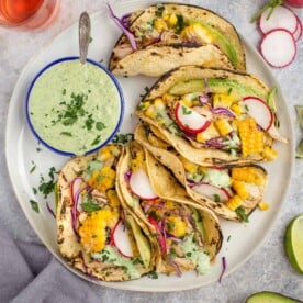 Grilled Corn and Chicken Tacos on a white plate