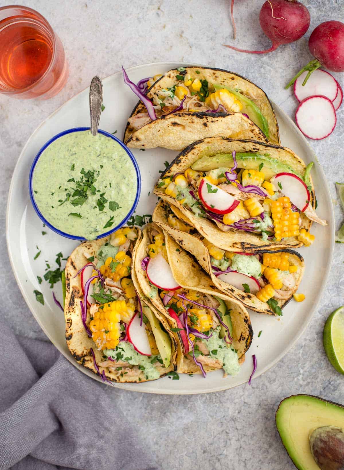 Grilled Corn and Chicken Tacos on a white plate