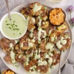 Grilled Smashed Potatoes on a white plate