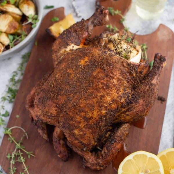 Pellet Grill Whole Chicken Roast on a cutting board.