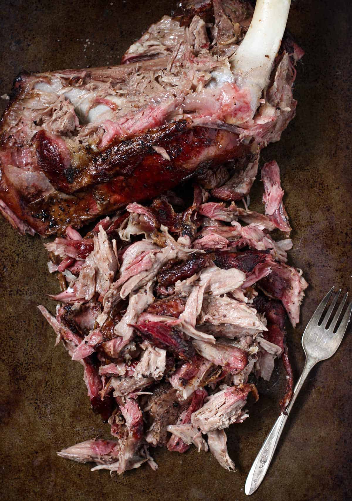 Pulled Smoked Lamb Shoulder on a sheet pan 