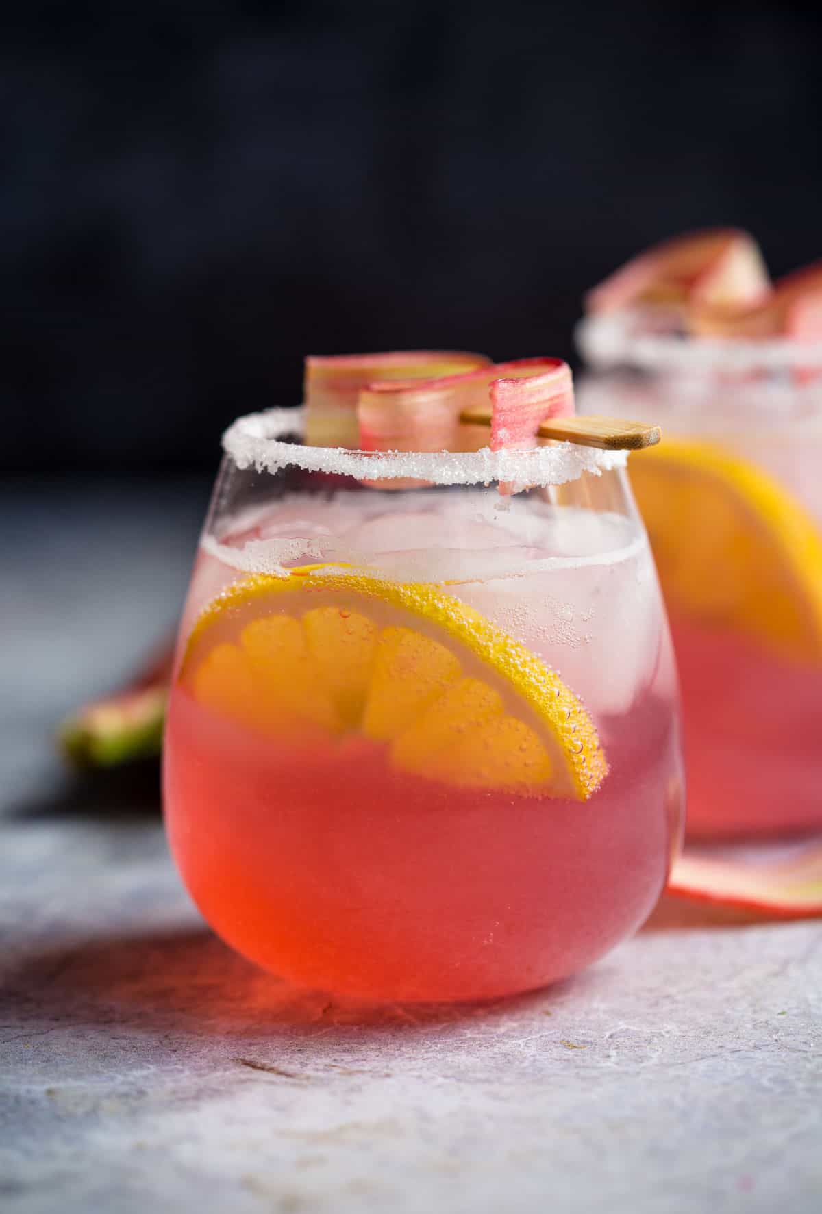 A cocktail with rhubarb simple syrup, lemon, and club soda