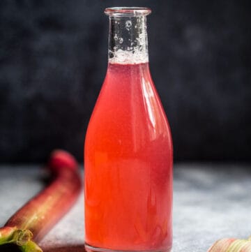 Rhubarb simple syrup in a small jar.