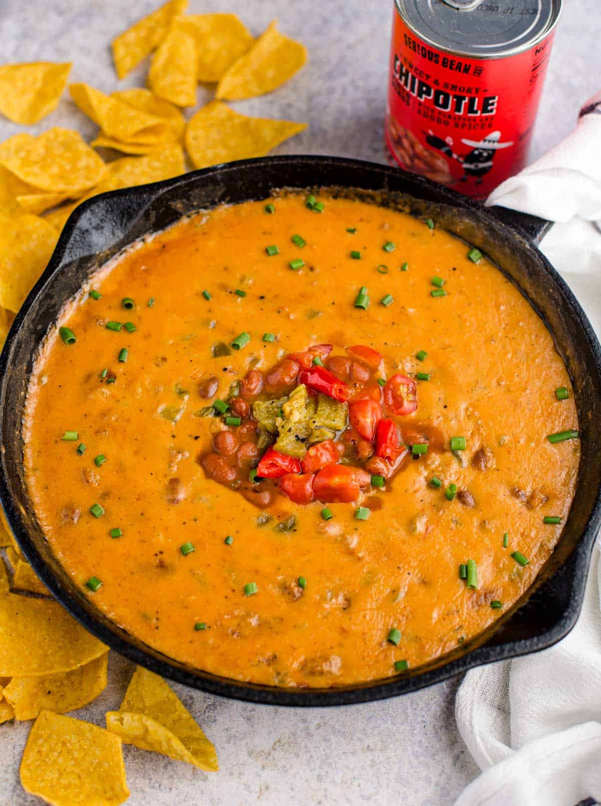 Sausage Queso Bean dip in a cast iron pan