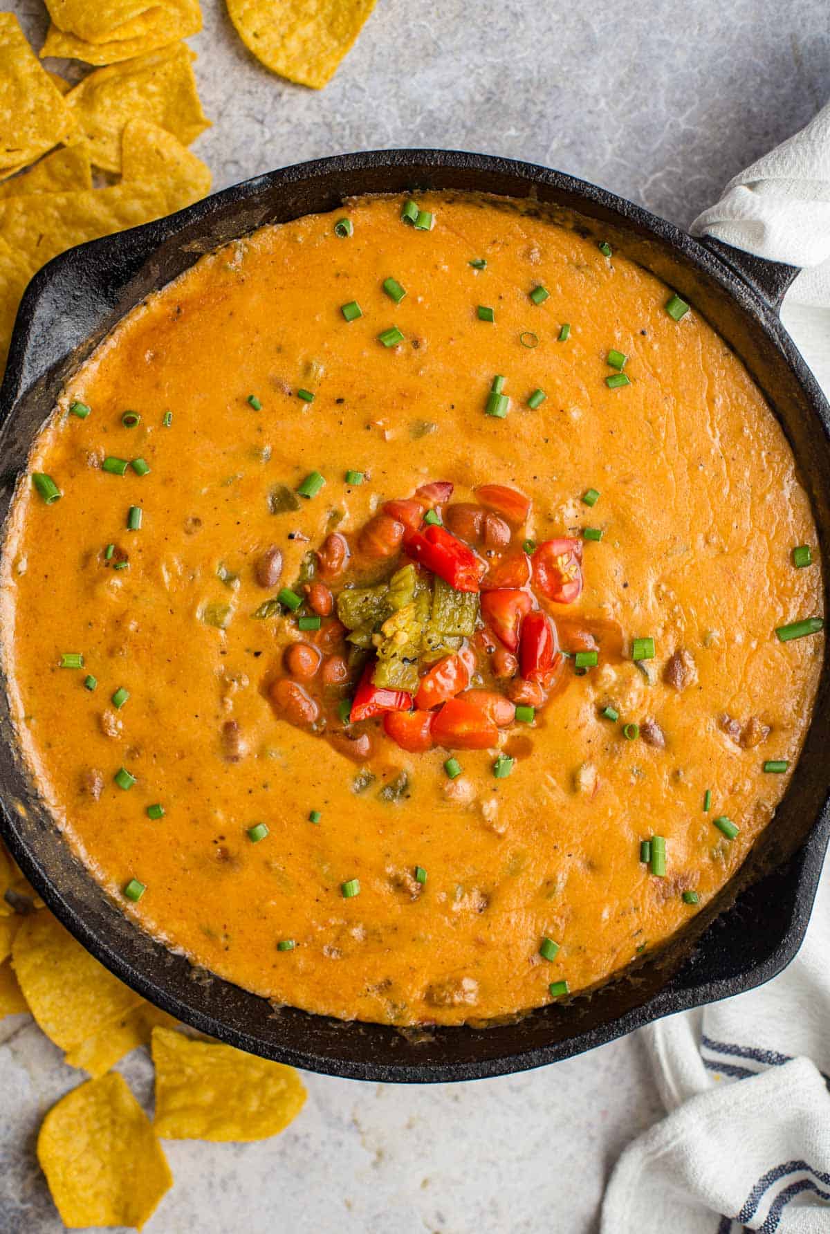 Sausage and Queso Bean Dip in a cast iron pan