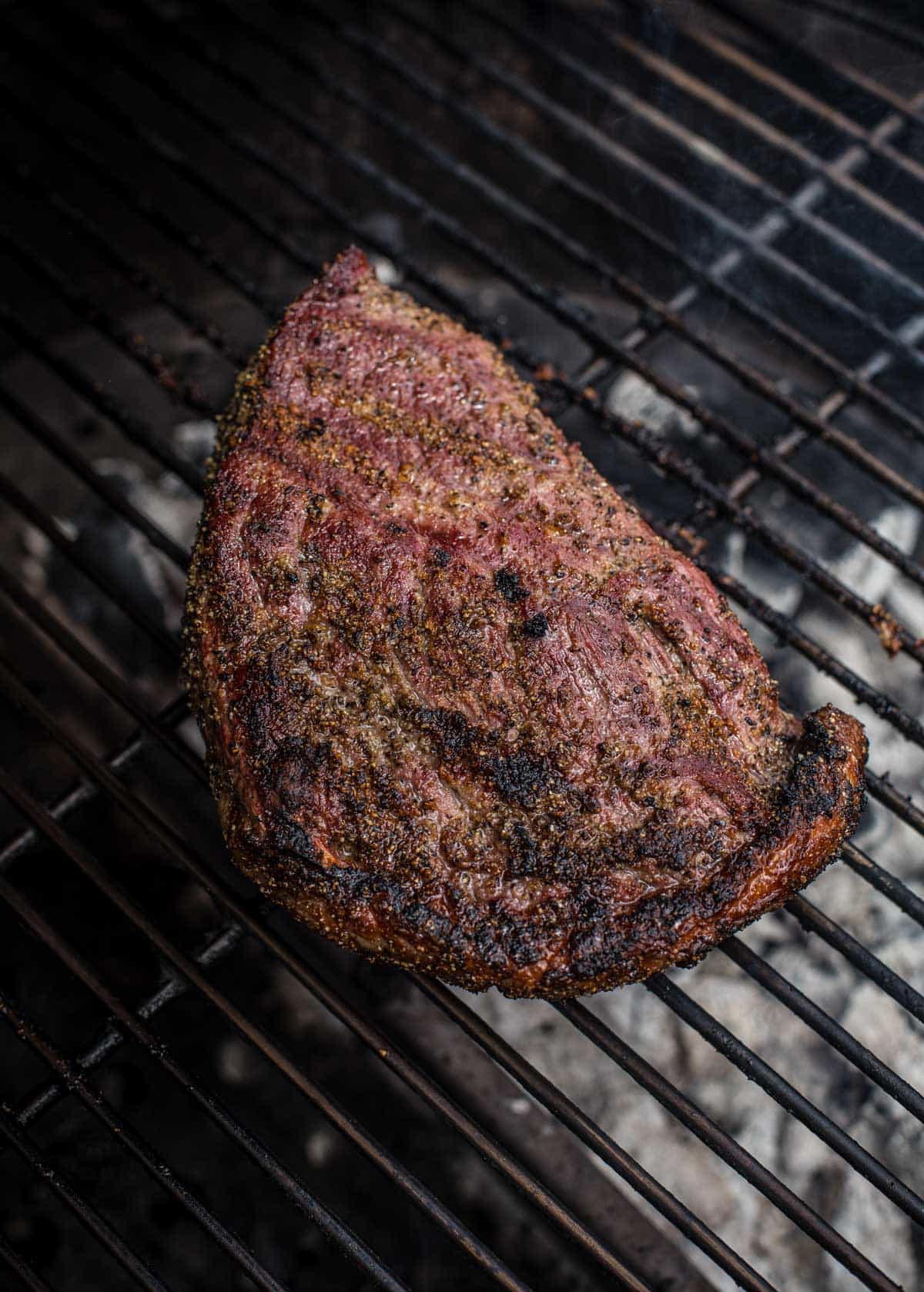 A sirloin steak on the grill