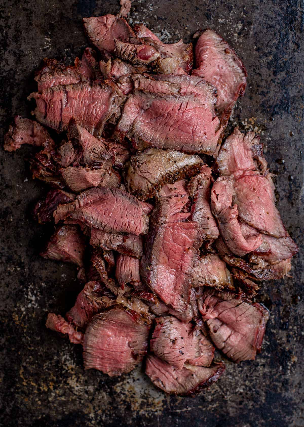 Thin slices of grilled steak for cheesesteak sandwiches