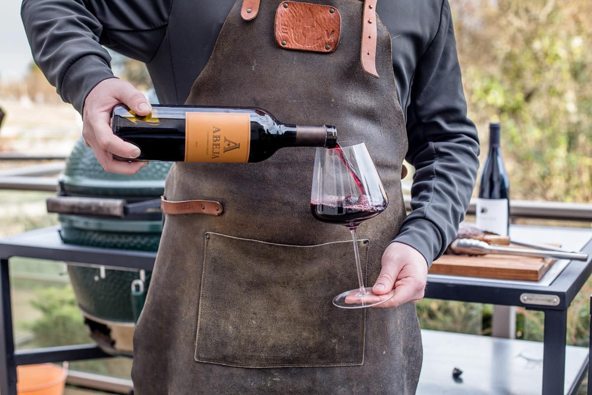 Pouring a glass of red wine