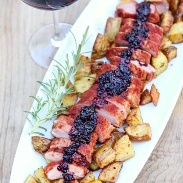 smoked pork tenderloin with blackberry bourbon sauce sliced