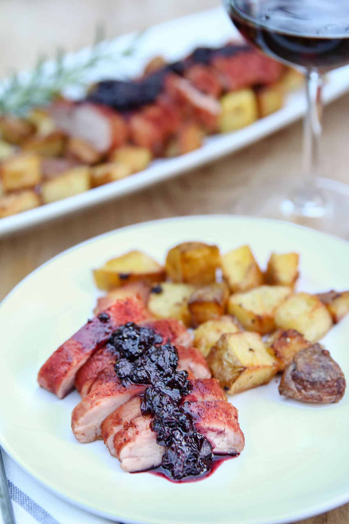 Pork Tenderloin with Blackberry Bourbon sauce on a plate