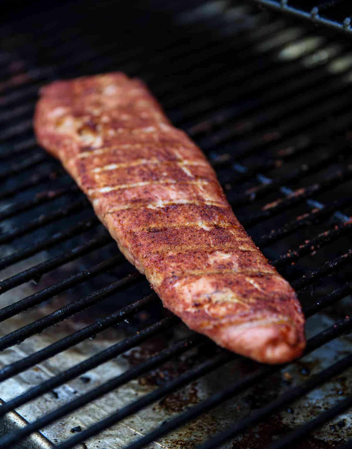 Smoked Pork Tenderloin cooking on a smoker