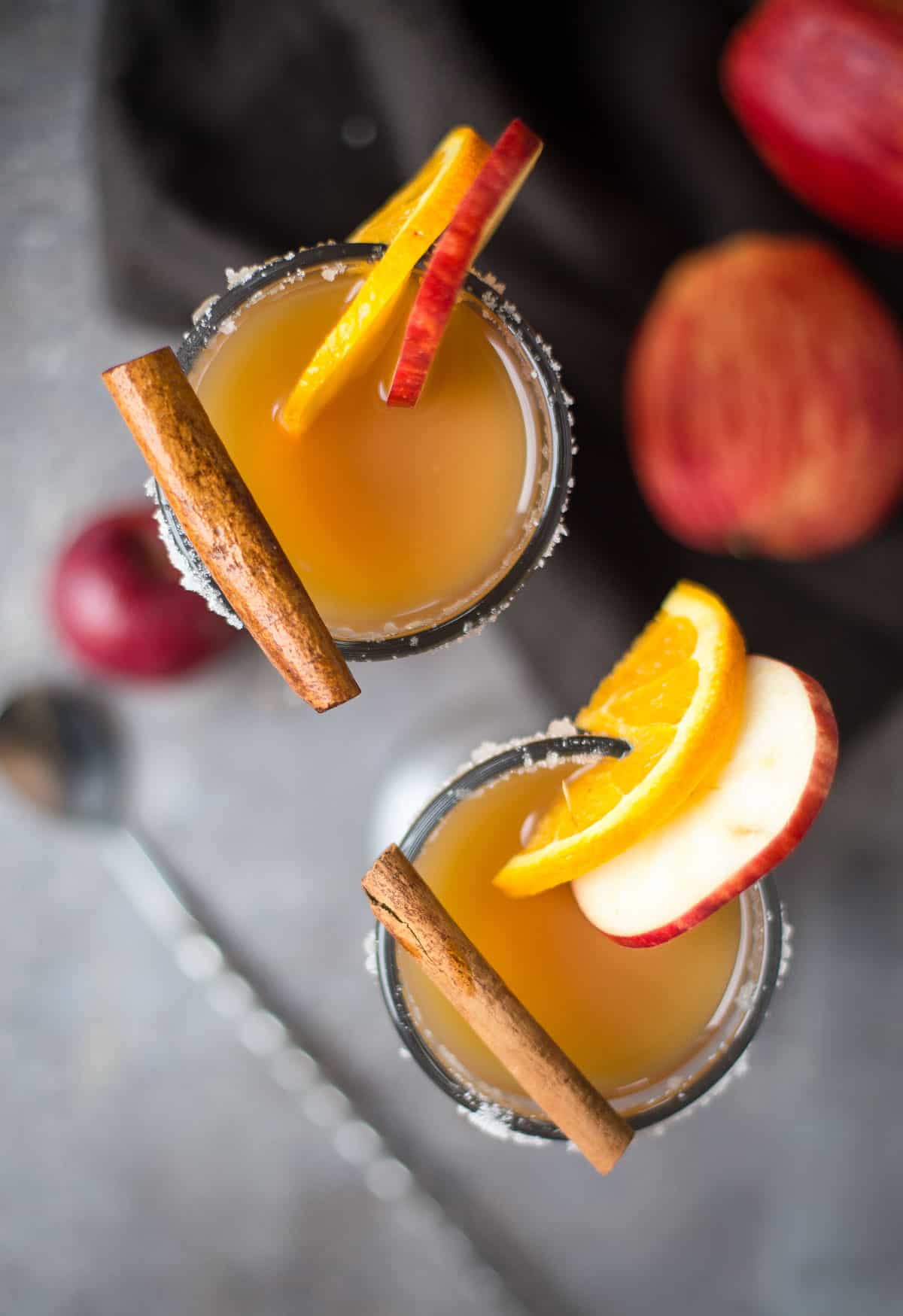 A topdown shot of two Bourbon Spiked Hot Apple Cider drinks 