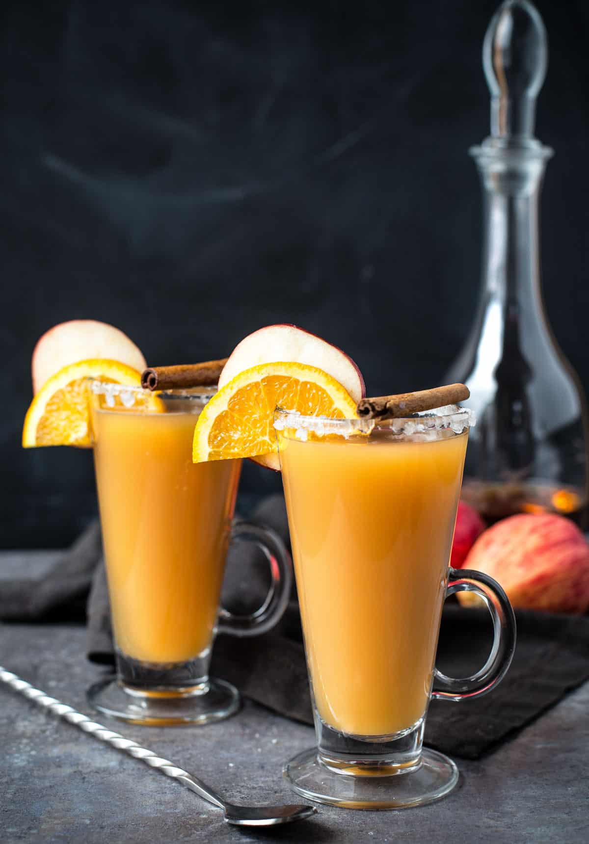 Two glasses of Bourbon Spiked Hot Apple Cider