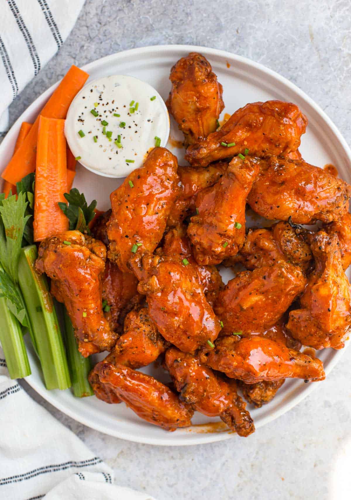 Grilled Buffalo Chicken Wings on a white platter