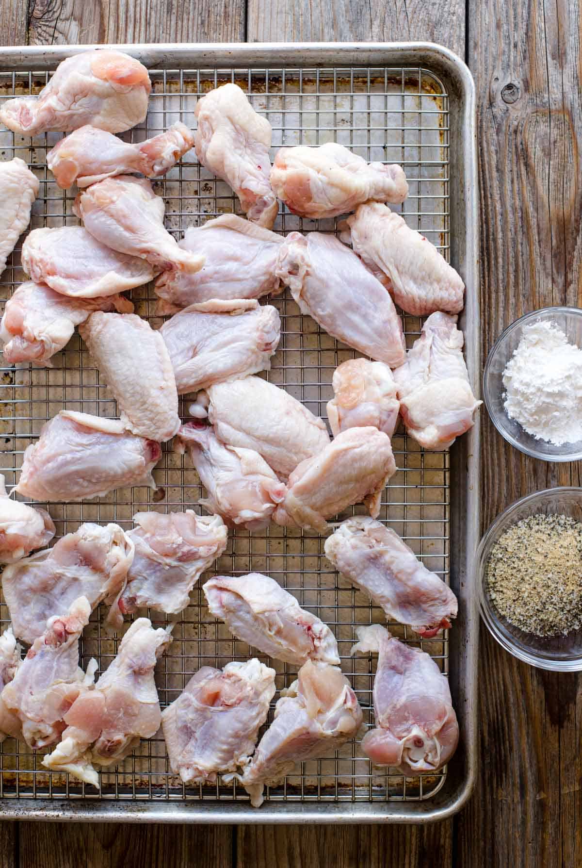 Ingredients for grilled buffalo chicken wings on a drying rack.