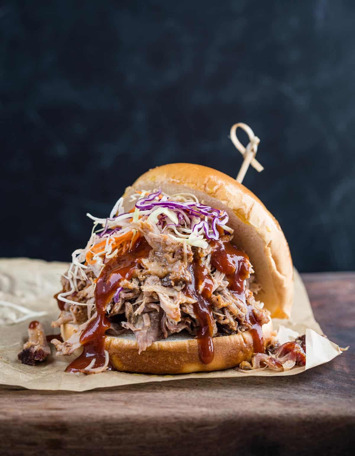 A pulled pork sandwich made with easy smoked pulled pork 