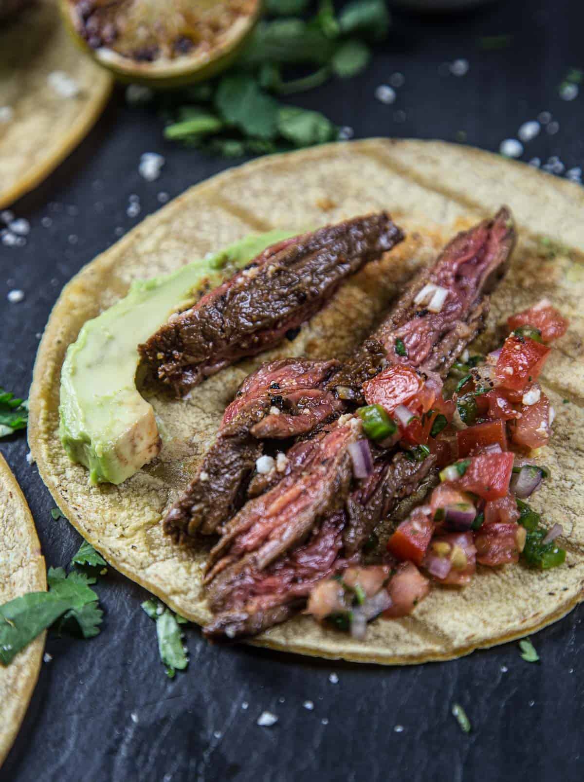 A Carne Asada skirt steak taco on a platter