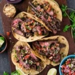 Carne Asada Tacos on a platter.