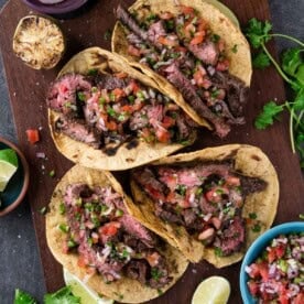 Carne Asada Tacos on a platter.
