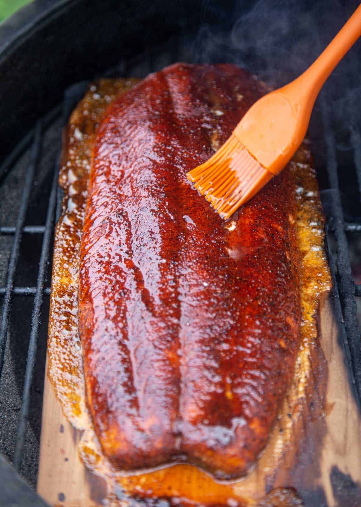 Glazing a Cedar Plank Salmon with a maple chipotle sweet glaze
