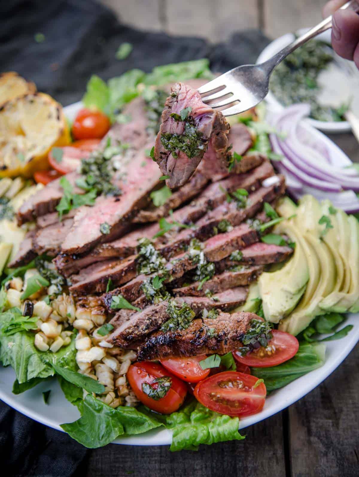 A bite of a steak salad 