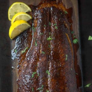 Cedar plank salmon with grilled lemon.