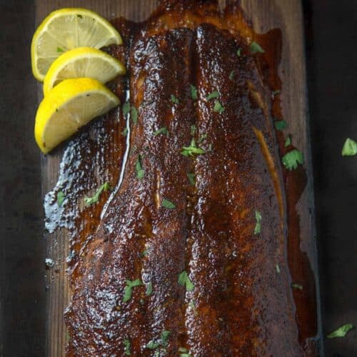 Cedar plank salmon with grilled lemon.