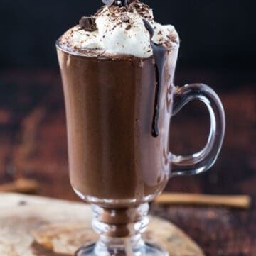 A glass of smoked hot chocolate with whipped cream