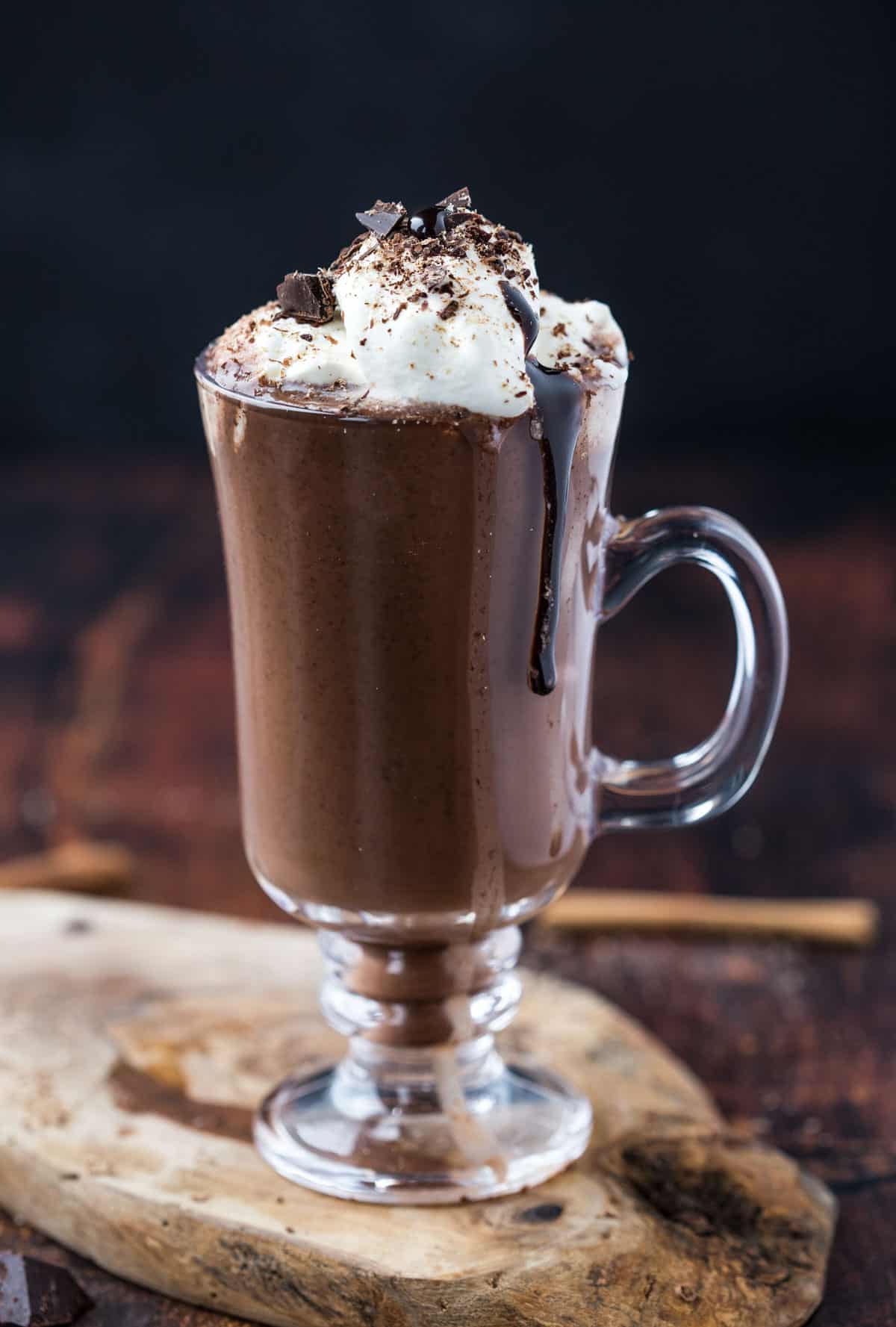 A glass of smoked hot chocolate with whipped cream