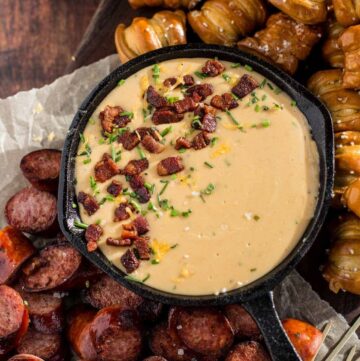Beer cheese dip in a cast iron pan.