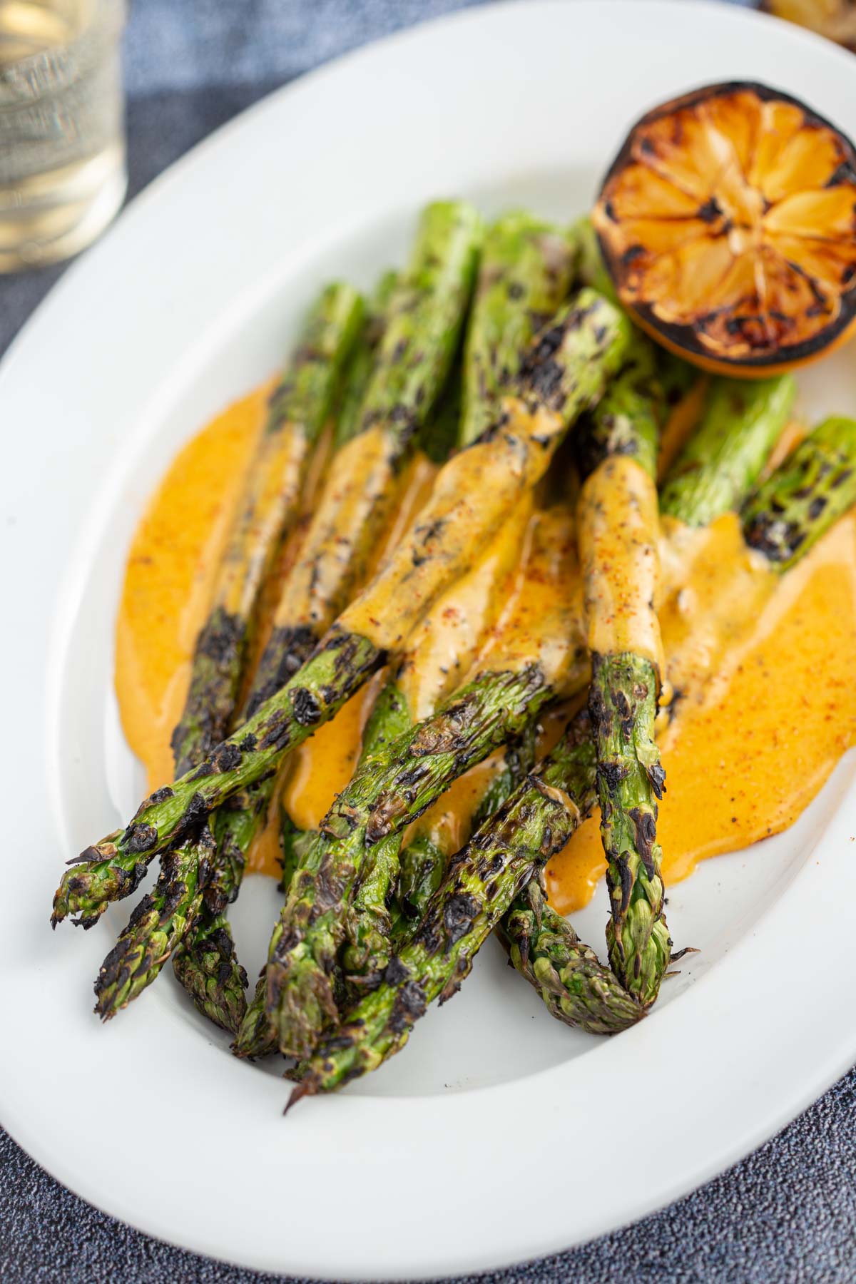 Grilled Asparagus with a BBQ Hollandaise Sauce on a platter